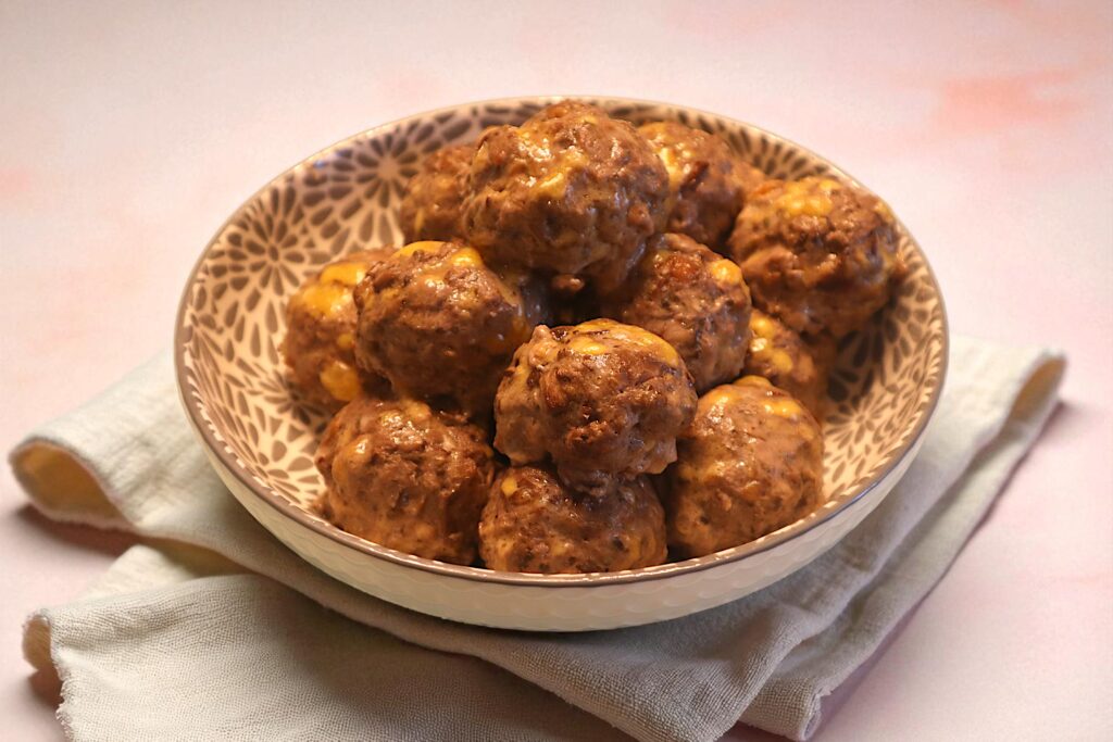A bowl of seasoned meatballs, a high-protein recipe and meal prep idea from a wellness coach.